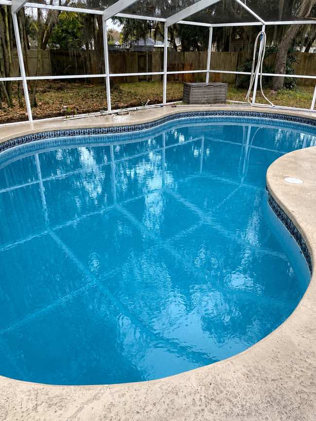 After: the same pool restored to crystal-clear blue water